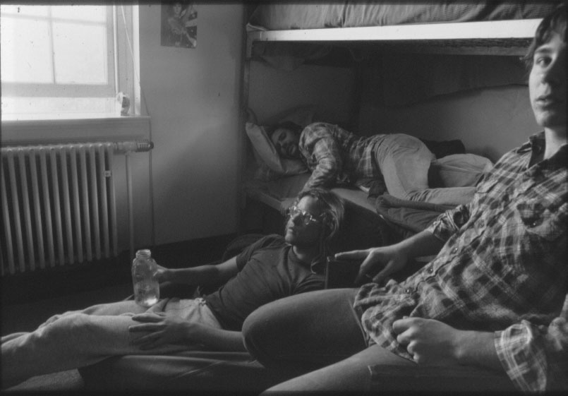 A somber-looking group waking up on an afternoon after a night before.